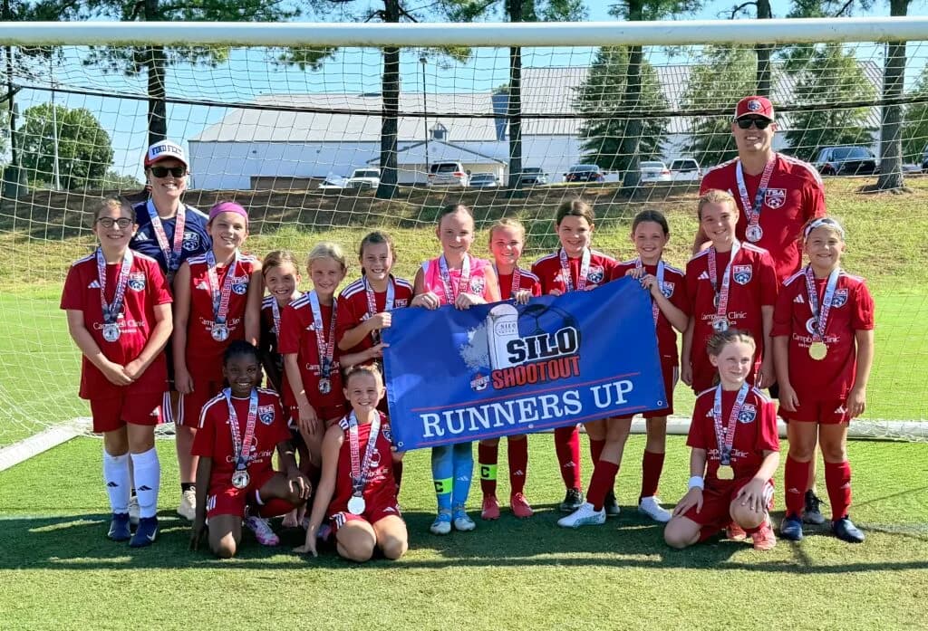 TSA players and coaches celebrating together after a tournament
